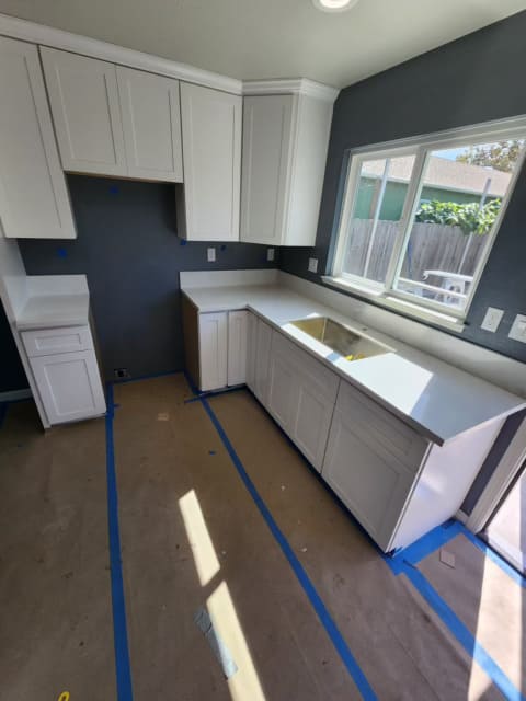Kitchen remodeling project with white cabinets and modern design in Gilroy California