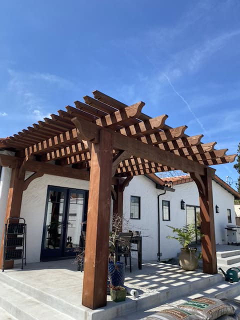 Modern concrete walkway with artificial grass landscaping in front yard California