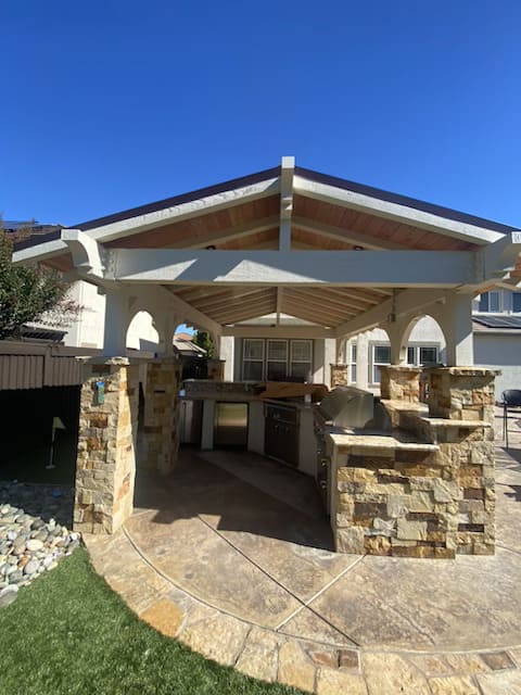 Modern patio with outdoor kitchen and lounge area designed by contractor in Bay Area California