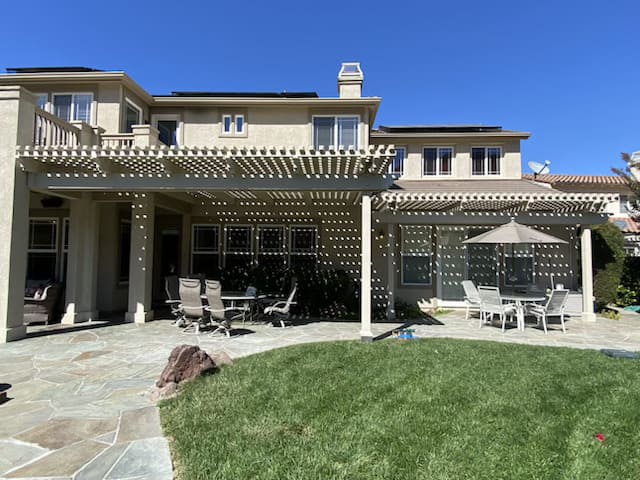 Modern wooden pergola installation in backyard patio by general contractor in Bay Area California