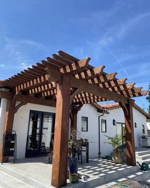 Modern concrete walkway with artificial grass landscaping in front yard California