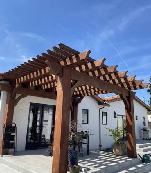 Modern concrete walkway with artificial grass landscaping in front yard California